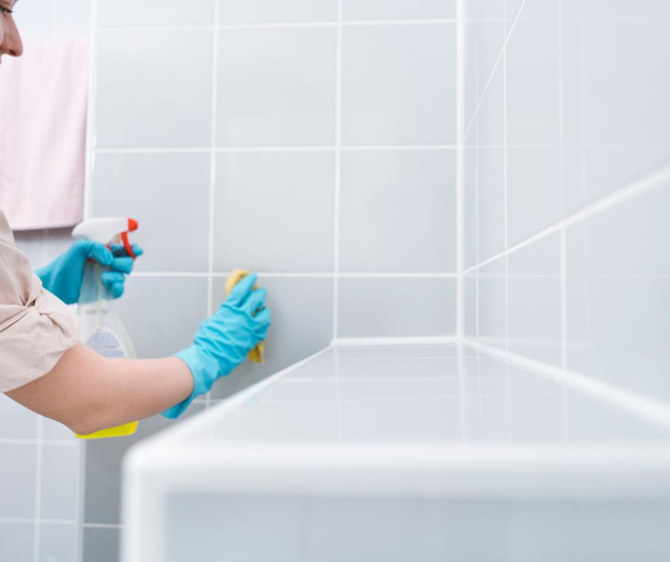 Women cleaning the bathroom walls