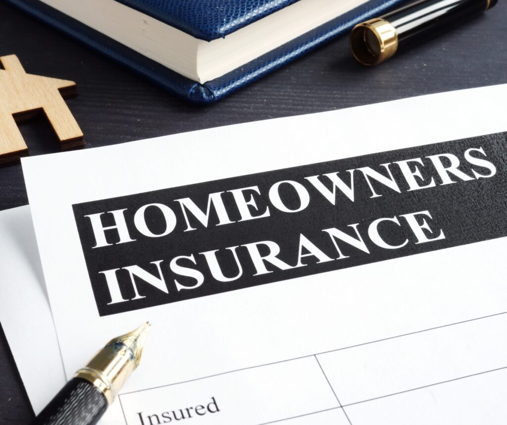 Homeowners insurance policy and model of home